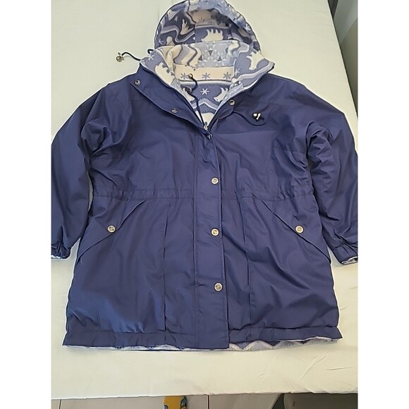 navy blue hooded anorak rain jacket with a polar bear print fleece lining. - Picture 3 of 6